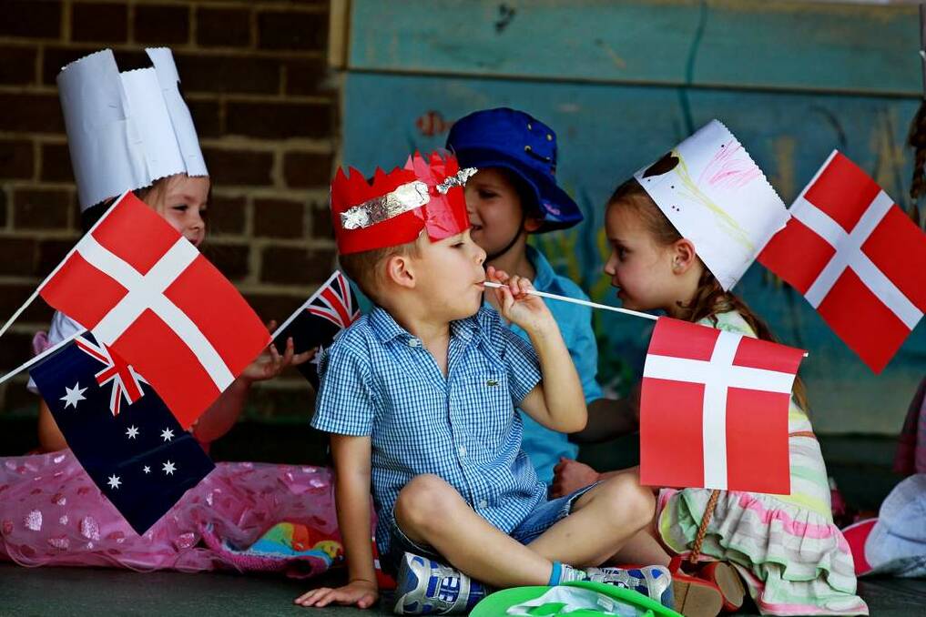 Preschoolers wait with flags for the arrival of Crown Prince Frederik and Crown Princess Mary of Denmark to Five Dock Public School for the Premier's Reading Challenge as part their official visit to Sydney. Photo: Ben Rushton