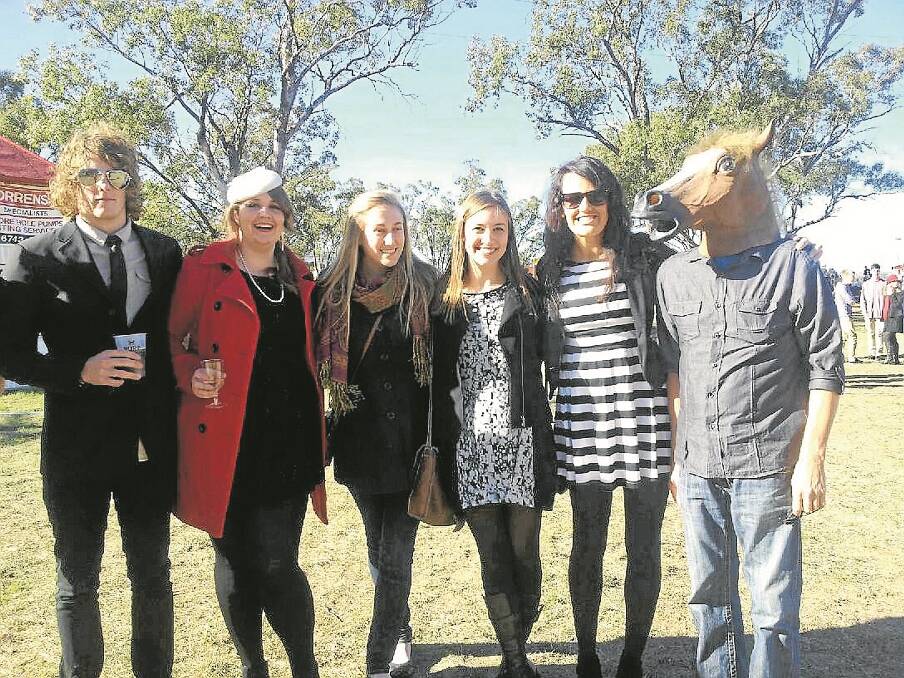 HORSING around. A mysterious horseman appeared in various photographs throughout the day. Pictured from left Zayn Abbot (Sydney), Victoria Sykes (Sydney), Kate Hartley (Gunnedah), Sarah Yates (Sydney), Ang Hartley (Gunnedah) and the mysterious horseman.