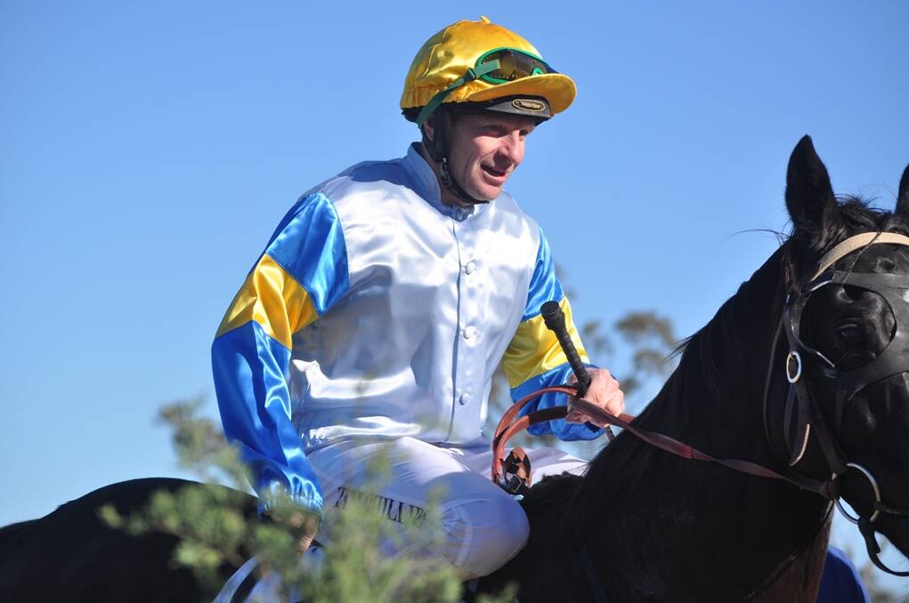 A JOCKEY'S elation as the race is over.