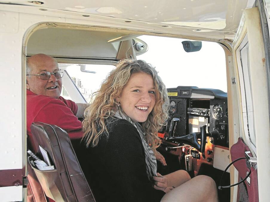GUNNEDAH High School student Kayla Smith is all smiles after her first flight with pilot Peter Middlebrook on Sunday.