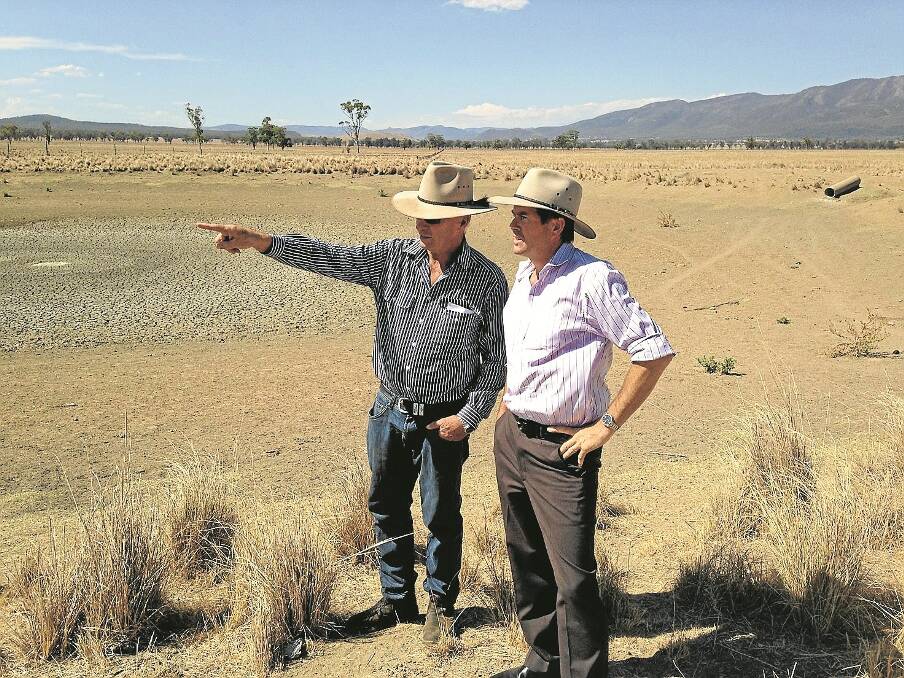  Gunnedah farmer Warren Nicholls on his property “Brolga” yesterday with Member for Tamworth Kevin Anderson.