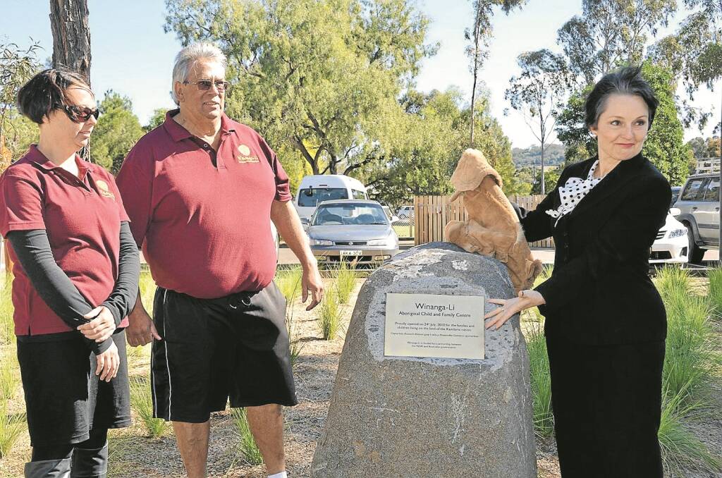 Minister for Family and Community Services Pru Goward, right, unveils the plaque at Winanga-Li acknowledging the support from the State Government. Minister Goward is pictured with Winanga-Li Early Childhood Director Allison West and centre manager Wayne Griffiths.