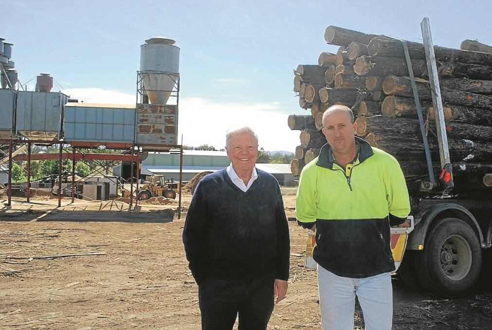 Paddy Paul gives Commissioner John Keniry a tour around Gunnedah Timbers yesterday.