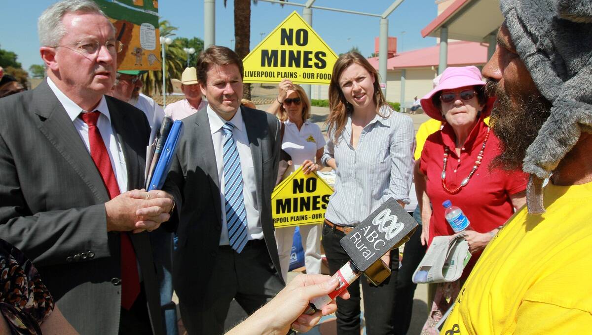 Planning Minister Brad Hazzard and Member for Tamworth Kevin Anderson speak to coal and coal seam gas protesters outside the Community Cabinet meeting in Tamworth, yesterday.