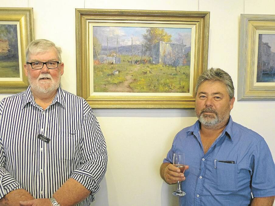 Gallery owner Chris Burgess and exhibiting artist Kasey Sealy.