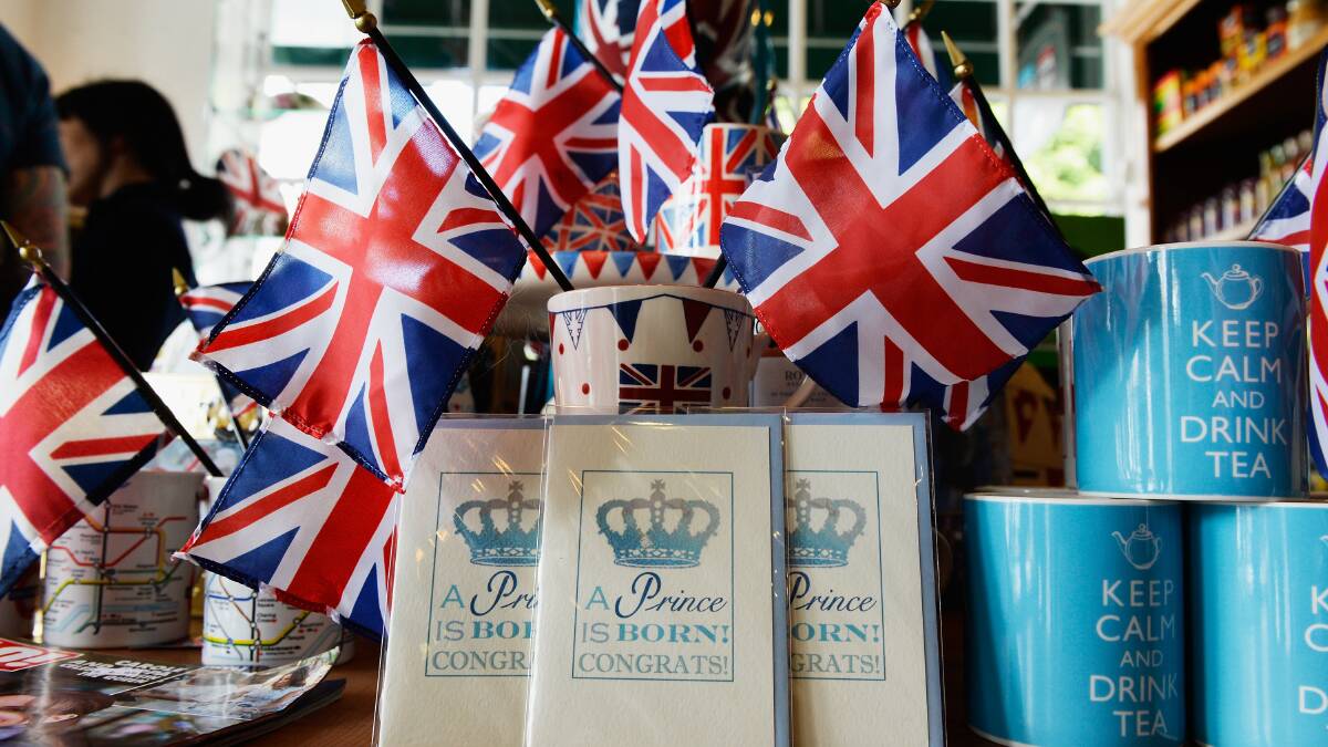 A baby announcement card and flags adorn the gift shop of Ye Olde King's Head English pub to celebrate the announcement of the birth of a baby boy. Picture: Getty.
