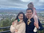 ARRIVED: Julia, Daneliia and Volodymyr Siedov at Tamworth's Oxley Lookout. Photo: Supplied