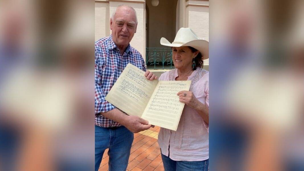RARE: Tamworth Country Music Festival manager Barry Harley and Roslyn Lindsay with the 1947 manuscript. Photo: Jodie White