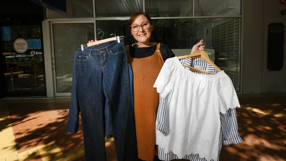 PRE-LOVED: Lifeline store Manager Katy O'Malley shows off what will be on offer at the new Peel Street store. Photo: Gareth Gardner