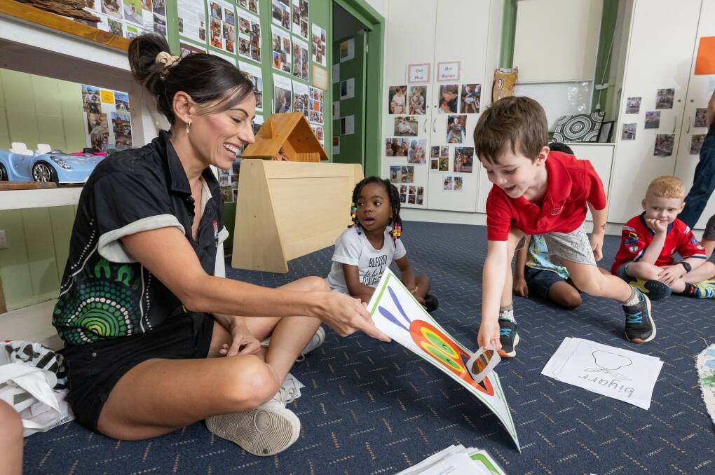 Winanga-Li Aboriginal child and Family Centre language hub coordinator Renee Houldsworth with St Mary's Preschool students Daniella Destiny and Wynn Townsend have fun in a Gamilaraay language class. Picture by Peter Hardin