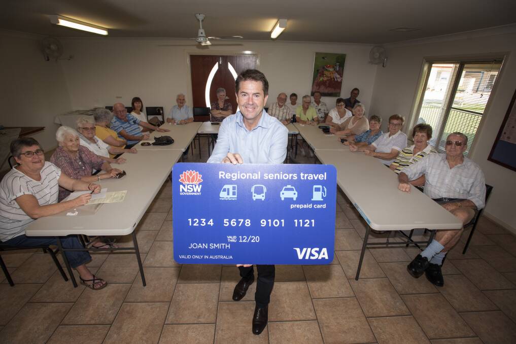 Card it: Tamworth MP Kevin Anderson explains the benefits of the transport card to residents at Easy Living Villas. Photo: Peter Hardin 100220PHB002.