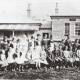 Old school yard: Gowrie School, one of the great little Bush Schools in the Tamworth district that no longer operate, pictured here in 1922. The teacher David Rynd with wife and child on the left. Photo: Supplied