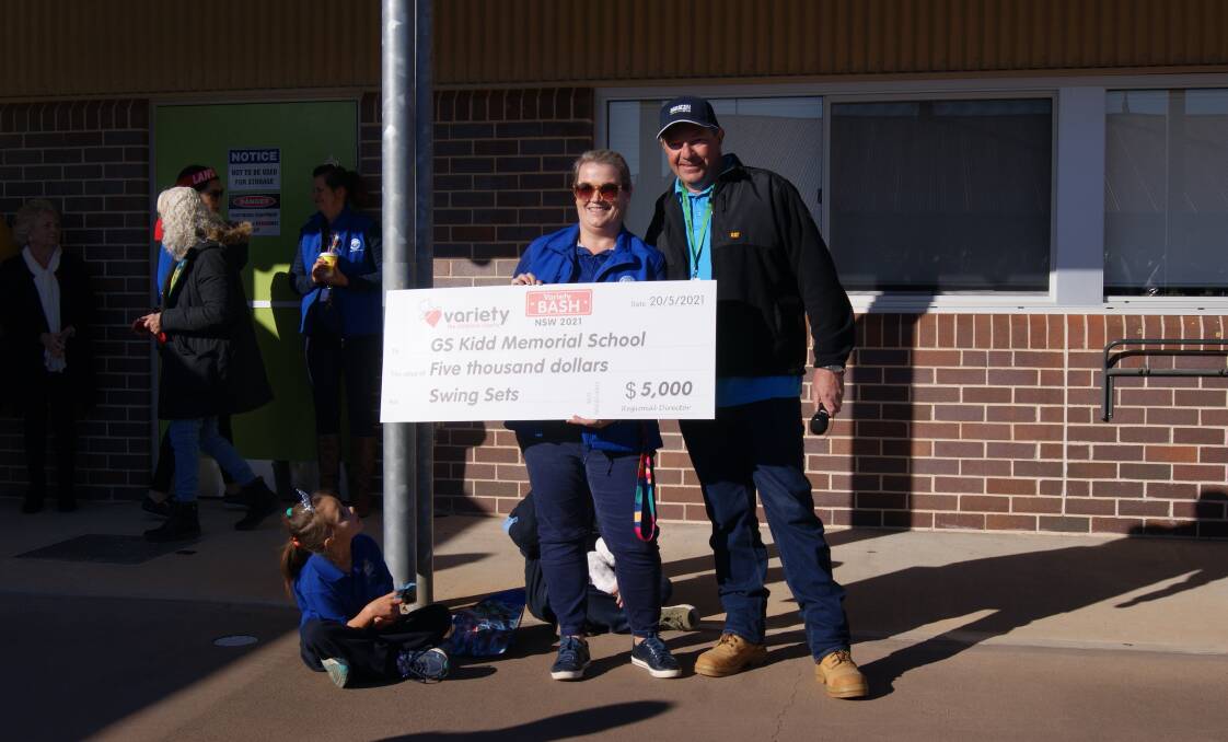 Happy days: G S Kidd Memorial School principal, Bec Maybury, with Basher, Neil Linstrome from Team Daracon. Photo: Supplied.
