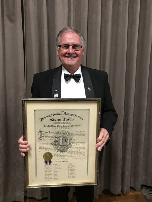 NEW LEADER: Nev Adams, pictured holding the Gunnedah Lions' charter, was sworn in as the new president