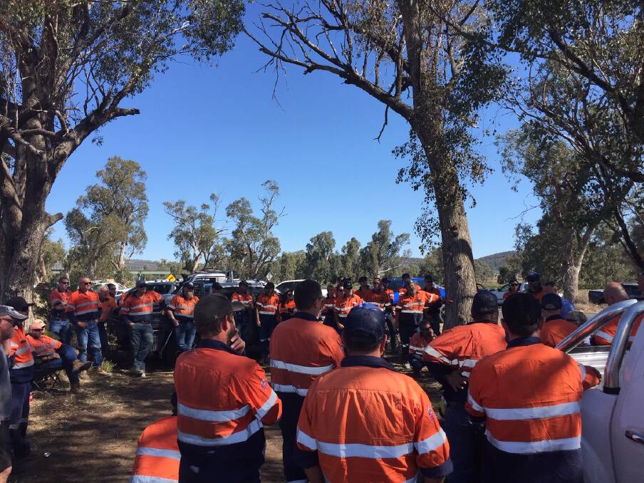 TOOLS DOWN: Hundreds of workers from the Boggabri Coal Mine gather out the front of the site's gates in protest of the workplace agreement on offer.