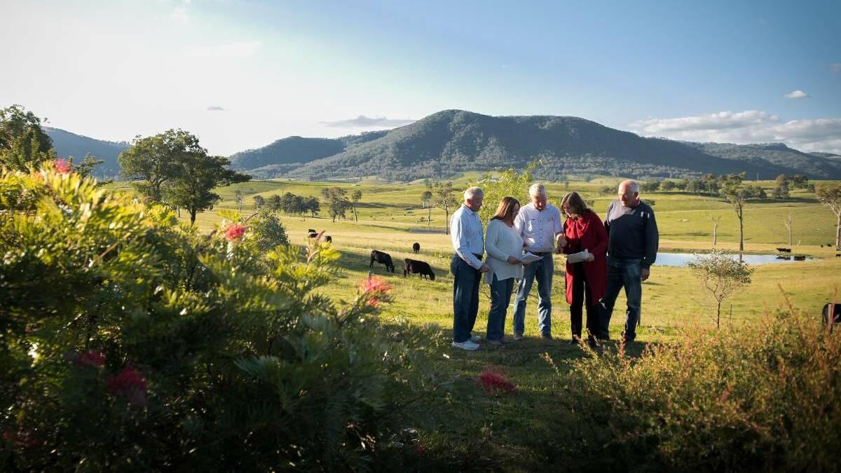  Meg Bowman, in red, president of the Hunter Gas Landholders Rights Alliance Inc, with landholders north of Maitland, in 2017, discussing concerns over the project.