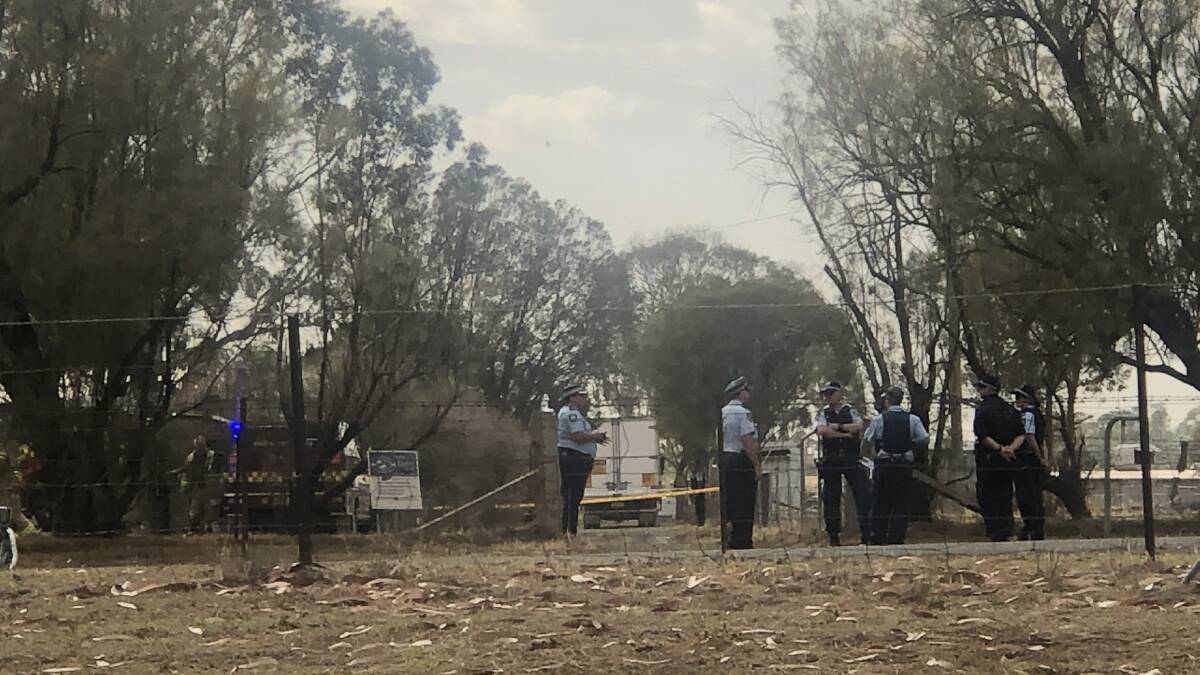 Crime scene: Police and fire crews at the home in Tamworth on Thursday morning. Photo: Breanna Chillingworth