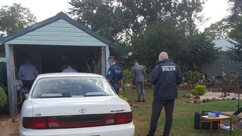 Search warrant: Oxley police at the Baker Street raid in Gunnedah on February 28. Photo: Oxley Police District