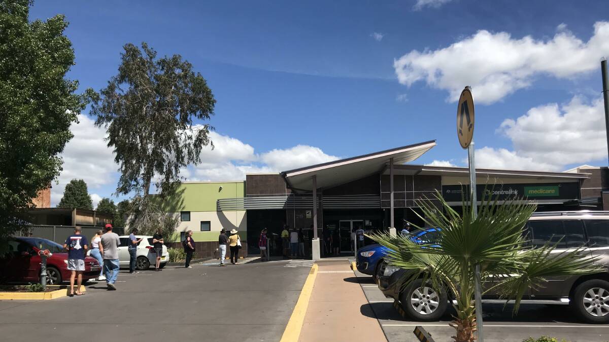 Waiting game: The line-up at Centrelink Tamworth was out the door on Monday, and is one of the "essential services" police will patrol. Photo: Anna Falkenmire