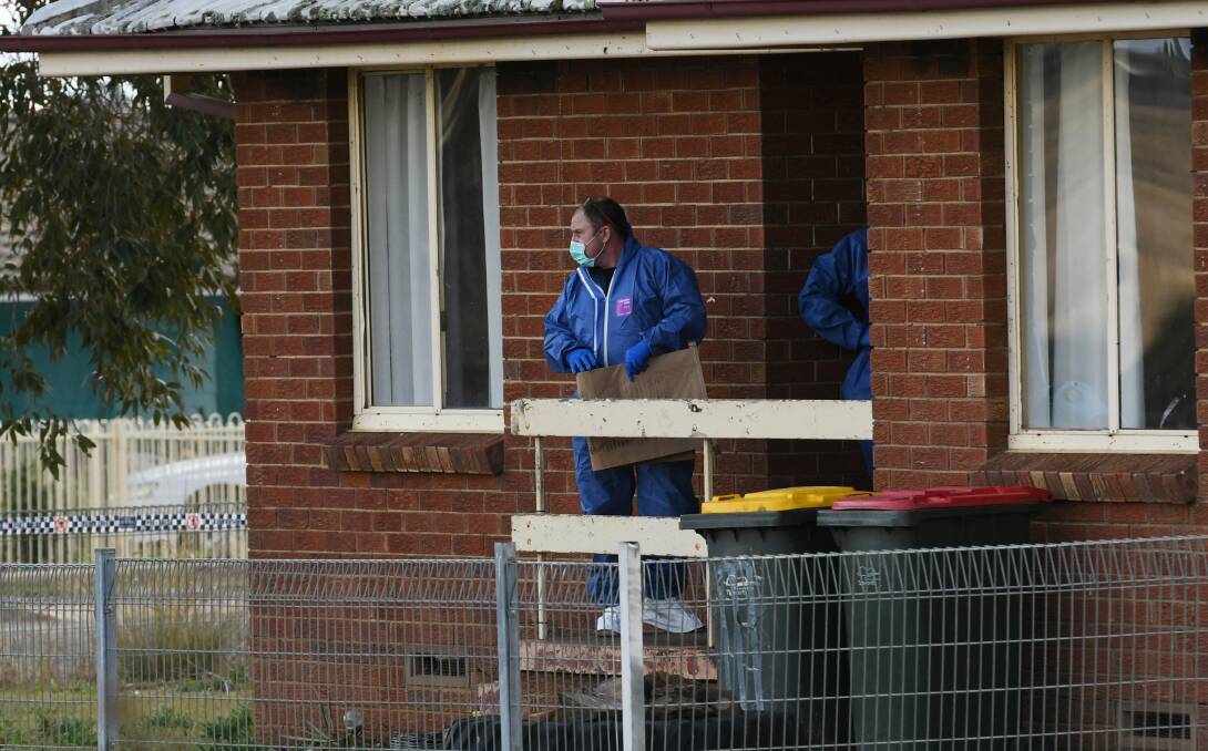Crime scene: Police and forensic officers comb the home where the man was stabbed to death in Green Street in Coledale in Tamworth early on Saturday. Photo: Gareth Gardner