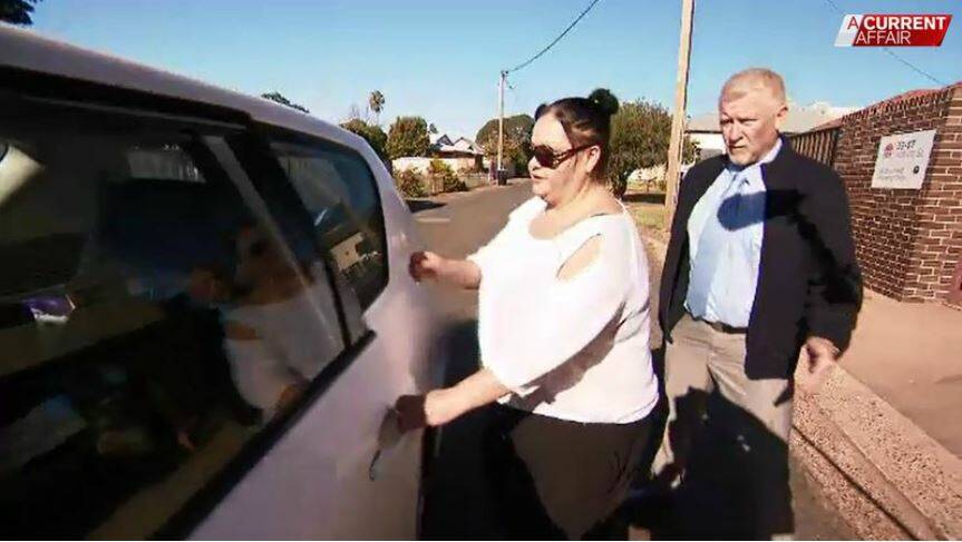 On bail: Marie Wanless, being confronted by A Current Affair in Gunnedah in July, after the Leader revealed her town-wide shopping ban. Photo: A Current Affair