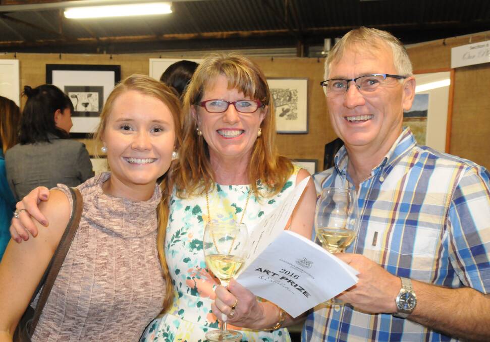 POPULAR EVENT: Alli Korn with Debbie and Ken Thompson at the official opening of the art prize and exhibition last year.
