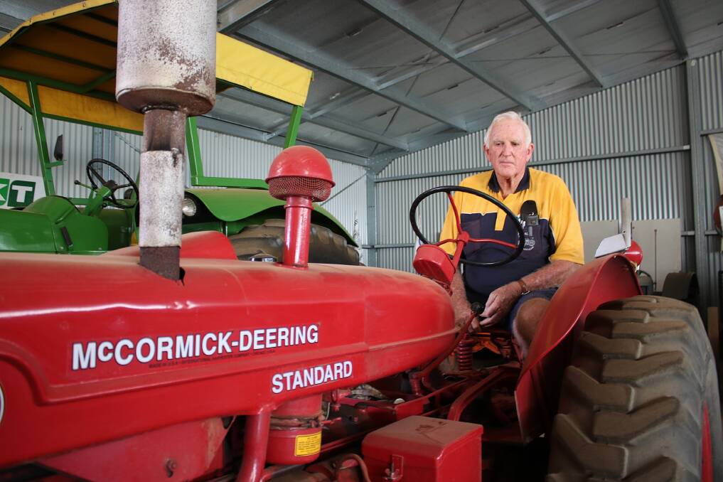 Gunnedah Rural Museum's Ian Guest on one of the tractors that will be fired up for the Tractor Trek.
