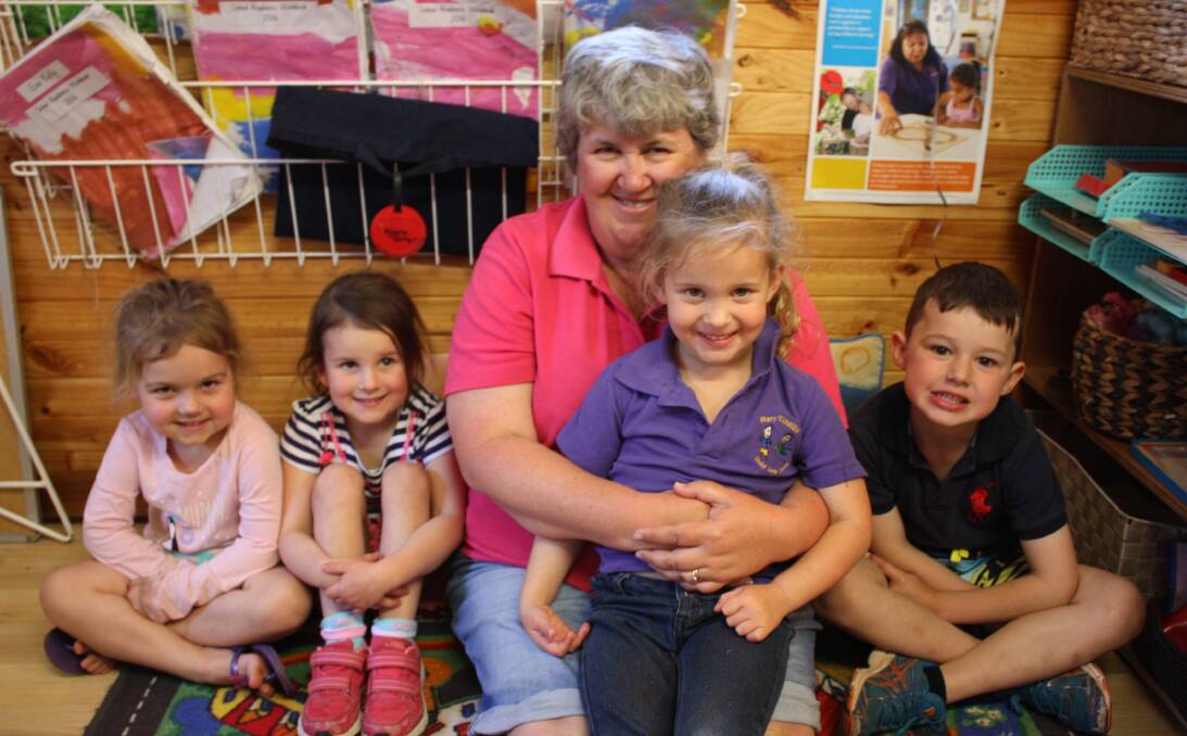 Top award: Early childhood teacher Fiona Langdon (centre) has been recognised for her work at Mary Ranken Child Care Centre. She is pictured here with Darcie Crane, Ella Sloane, Amee Hobden and Gus Simpson.