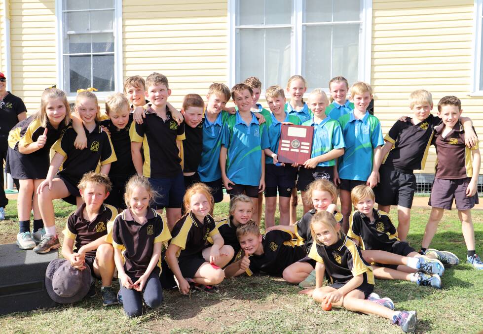 Mullaley Public School students win the percentage trophy at disocese cross country. Khloe Greig, Clara Bradford, Charlotte Tulloch, Kyle Sanson, Clayton Sanson, George Bradford, Georgia Rose, Chas Jaeger, Jack Haire, Charlotte Craig, Kiara Guerin and Eamon Martin will compete in the area cross country on June 14. Photo: supplied