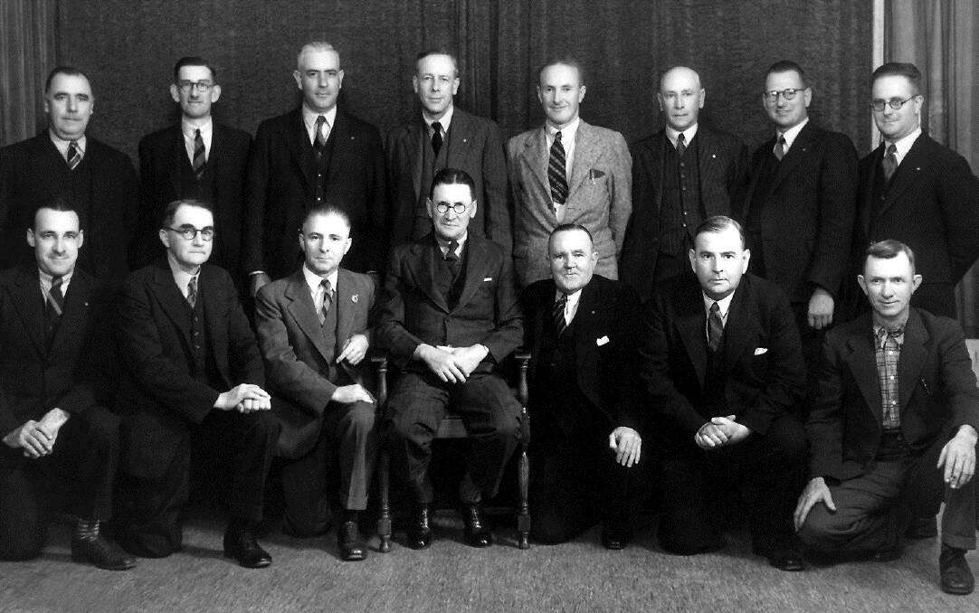 Charter members of the Rotary Club of Gunnedah 1938. Standing, from left, Bert Duff, Vic McAdam, MJD Austin, Dr Colin Anderson, Frank James, Henry Marcroft, Les Gale, Eric Coates. Seated: Cyril Smithurst, Jack Ahern, Hugh Wragge, Ashley Storey, Dave Owens, Russ McDonagh, Sam Morris. Absent: Dick Lightfoot, Doug Werner and Herb Williamson.
