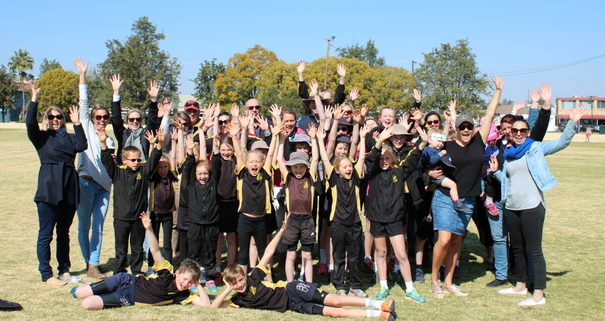 Mullaley Public School kids and parents celebrating the good news at Wolseley Oval on Friday.