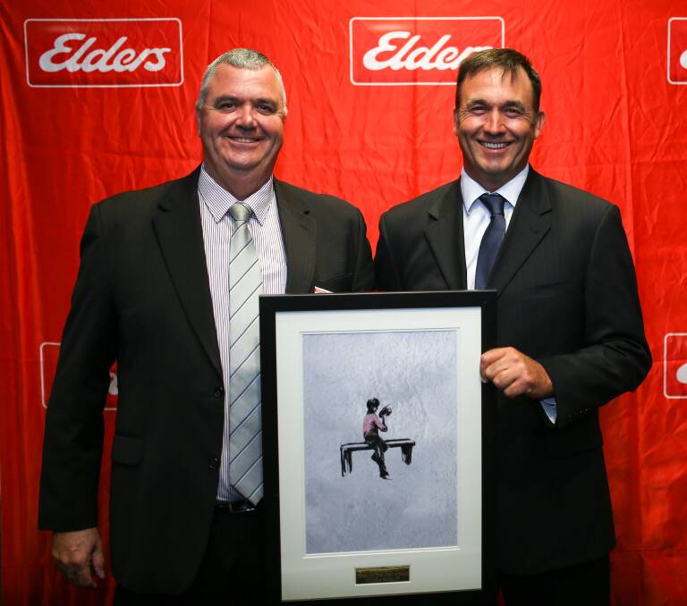 RECOGNITION: Gunnedah branch manager, Nik Hannaford (right) accepts an art work from North Zone general manager, Greg Dunne (left). Photo: Supplied