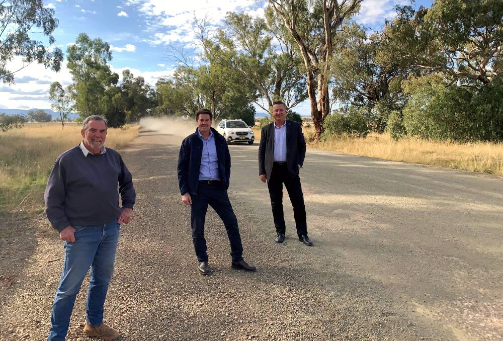 Landholder Robert White meets with Tamworth MP Kevin Anderson and Gunnedah shire mayor Jamie Chaffey on the unsealed section of Kelvin Road following the recent funding announcement. Photo: supplied