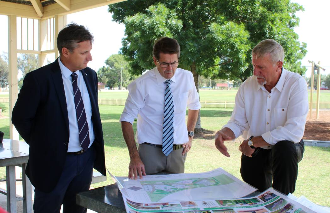 Gunnedah shire mayor Jamie Chaffey, Tamworth MP Kevin Anderson and councillor Owen Hasler review plans in late 2017. Photo: Vanessa Höhnke