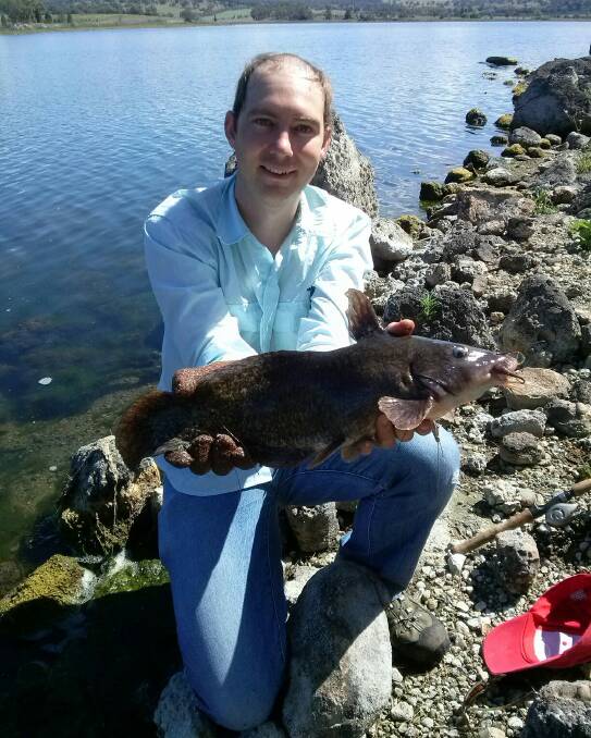 Mark Hohnke with a native catfish he caught on a lure at Quipolly Dam.
