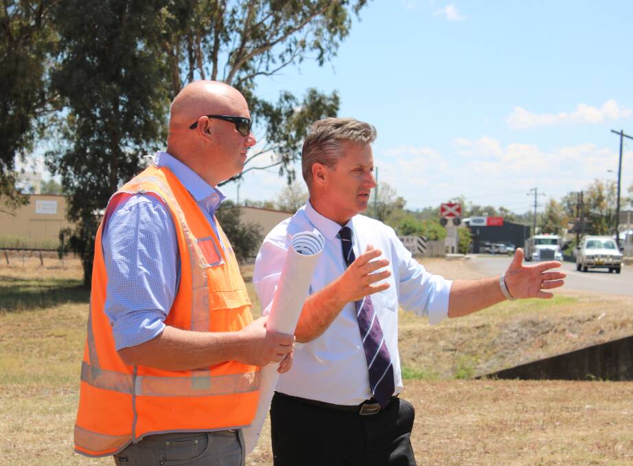 Daracon Group construction manager Adam King and Gunnedah shire mayor Jamie Chaffey discuss the rail overpass project on Friday.