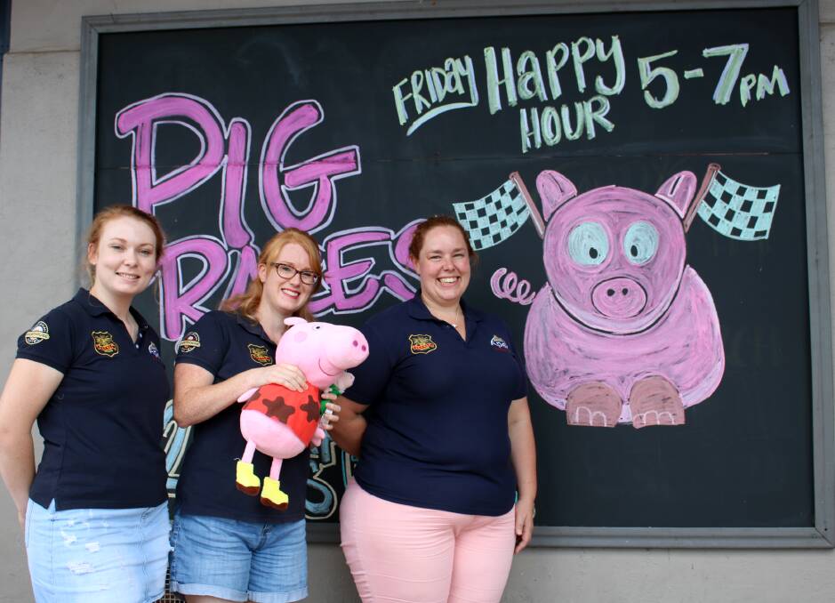 HAMMING IT UP: Apex members Nikole Brooks, Erin McCabe and Donna Austin are ready for Saturday's pig races.