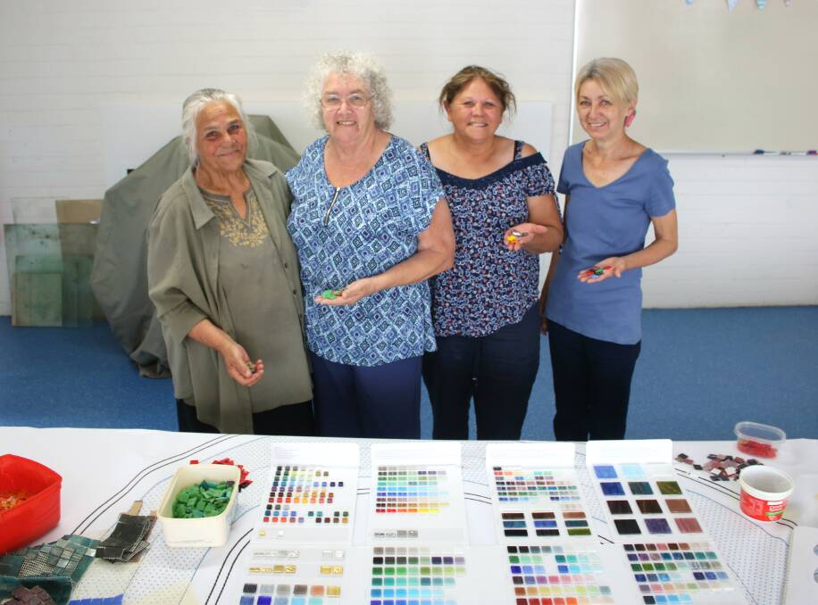 Kamilaroi women Shirley Long, June Cox, Gloria Foley and Alison Cox choosing tiles in 2017.