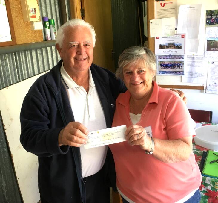 Gunnedah RDA president Max Small and treasurer Renee Hooke with the cheque from the golf club.