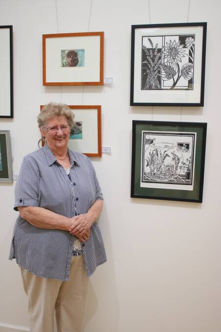 Gunnedah artist Anne Pickett with two of her prints (right), which feature in the exhibition. Photo: Vanessa Höhnke