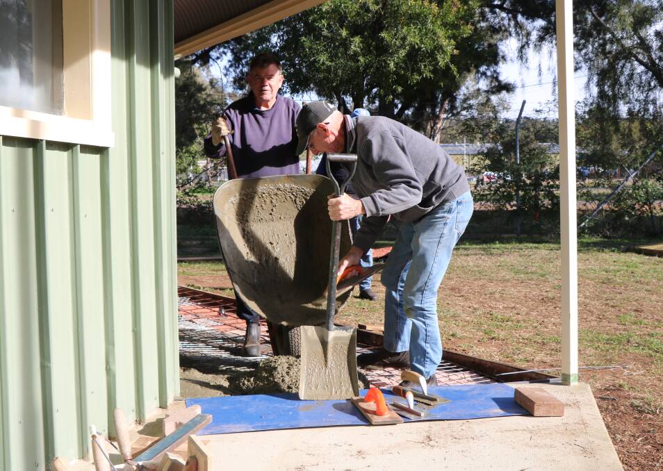 Kerry Bee and Neville O'Gorman pouring concrete for the path extension.