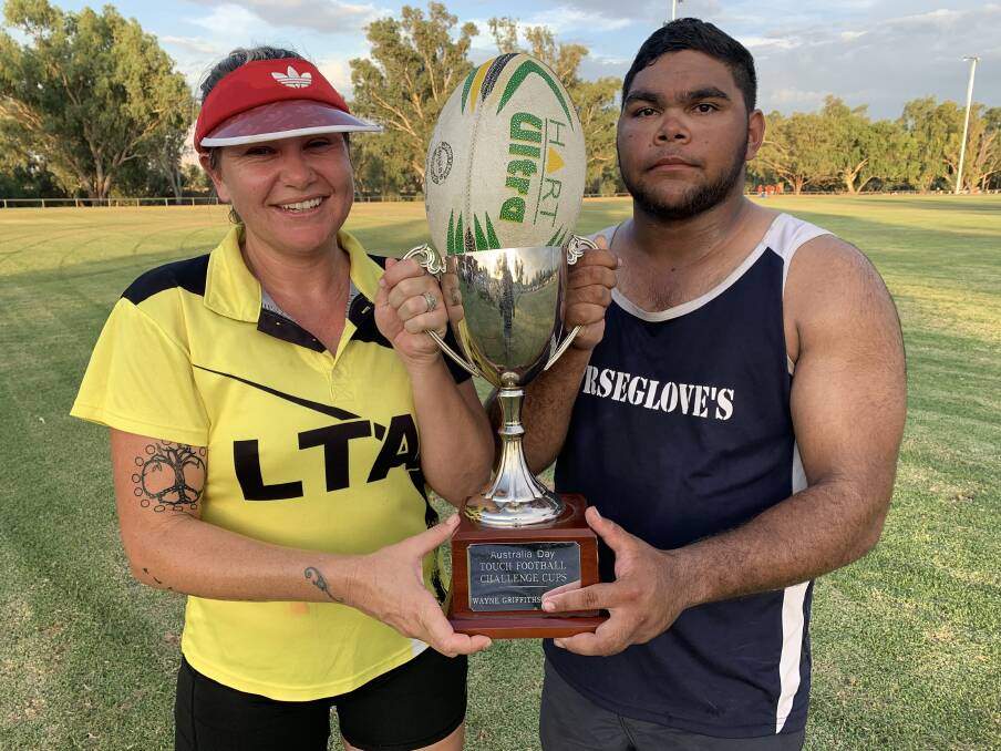 READY TO PLAY: Captains of the female and male Indigenous sides, Emma Costello and Hayden Smith, with the Wayne Griffiths Cup. Photo: John Hickey