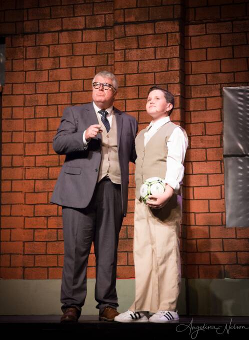 Steven Hopwood, right, in character as the young Charlie Price, with Mark Daly who played the role of his father, Mr Price, in Tamworth Musical Society's production of Kinky Boots. Photo: Angelina Nelson