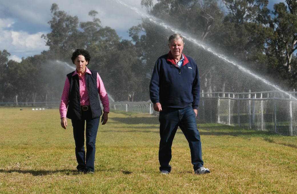 Gunnedah Jockey Club's Lyn Tongue and Kevin Edmonds at the Riverside Racecourse. The club has applied for government funds to install automated sprinklers on the second half of the course. Photo: Gareth Gardner