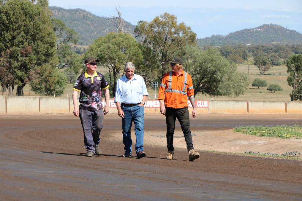 Gunnedah Motorcycle Club president Anthony Dall with deputy mayor Rob Hooke and local contractor Rhys Hinchcliffe on the track at Balcary Park.