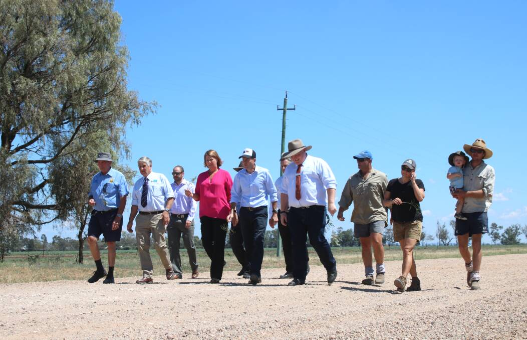 Mullaley residents, Gunnedah Shire Council staff, Minister for Roads, Maritime and Freight Melinda Pavey and Tamworth MP Kevin Anderson on the Grain Valley Road on Friday.
