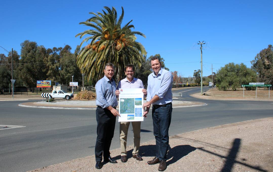 Gunnedah mayor Jamie Chaffey, Tamworth MP Kevin Anderson and Daracon project manager Mark Griffin with the plans for the rail overpass on Wednesday.