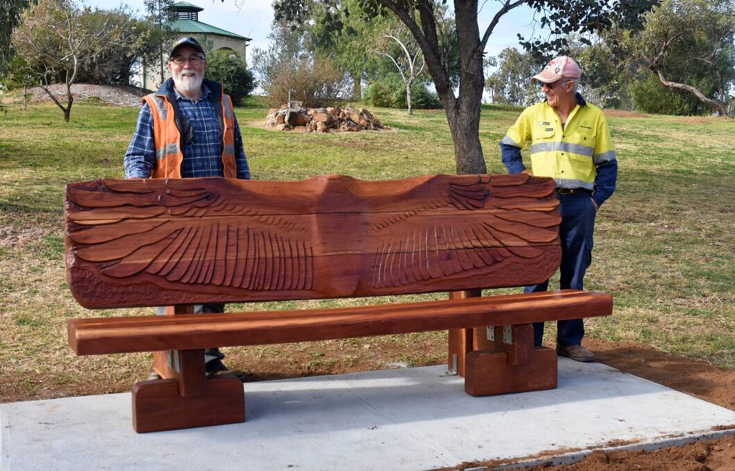 Woodturner Dan Birkett and concretor Peter Haley with the new timber seat. Photo: supplied