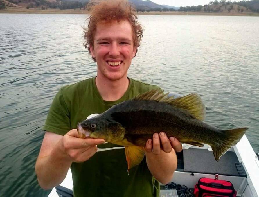 NATIVE BEAUTY: Ben Hohnke with a native Golden Perch (yellow belly) he caught on a lure at Chaffey Dam which is popular with anglers.