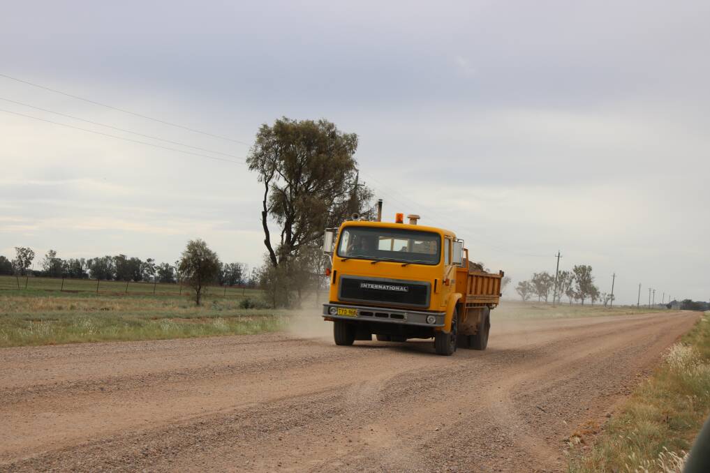 A vehicle travels on the unsealed section of the Grain Valley Road on the approach to Mullaley.